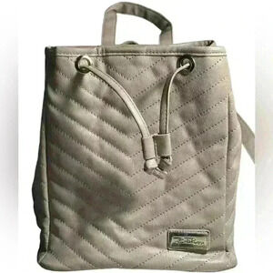 A grey Bella Russo quilted bucket bag / backpack combination purse.